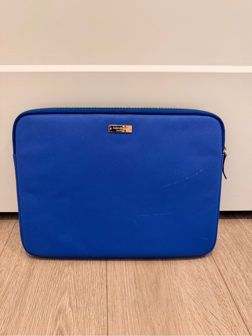 kate spade royal blue zip laptop sleeve with gold logo